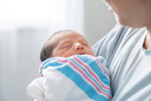 Newborn in Mothers Arms